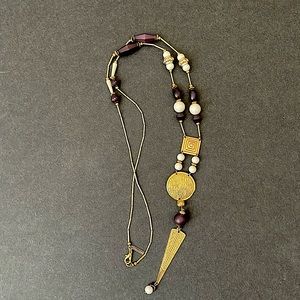 Long necklace. Gold with dark navy blue and white beads.
